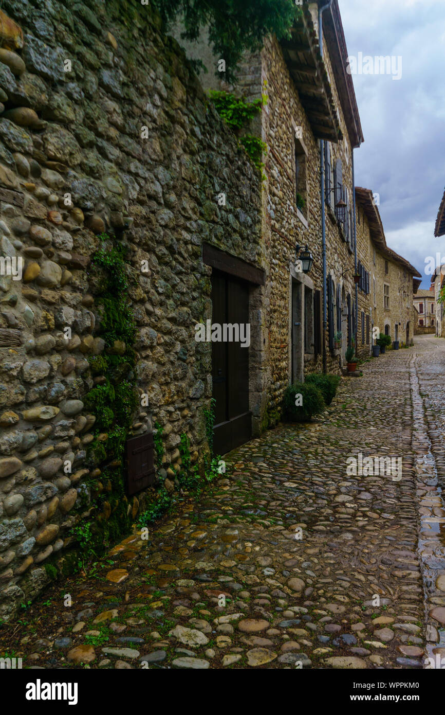 View of an alley in the medieval village Perouges, Ain department ...