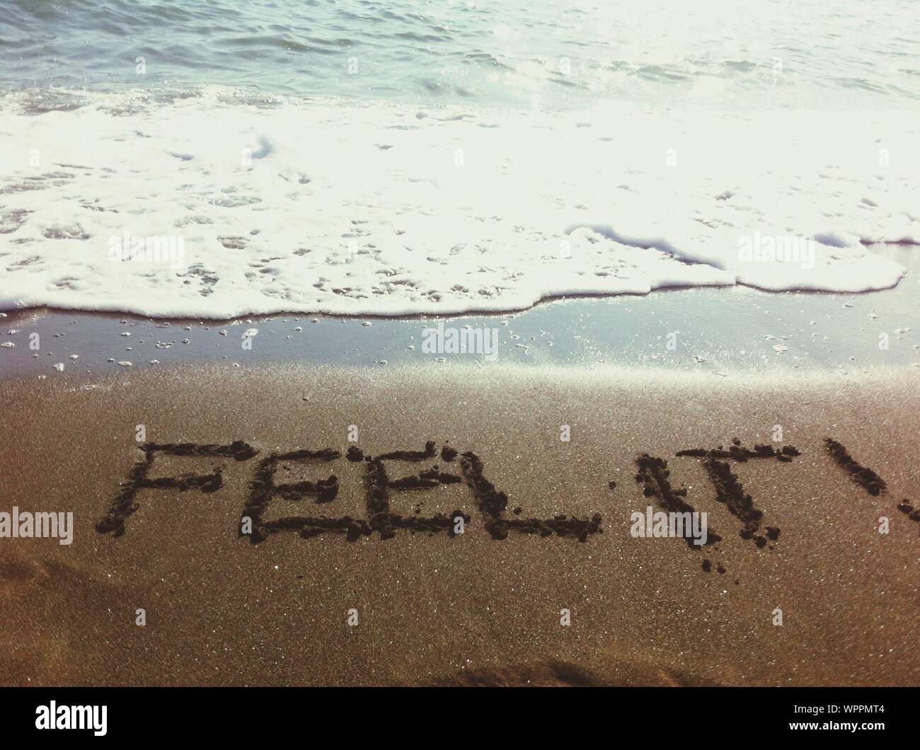Feel It Written In Sand Stock Photo