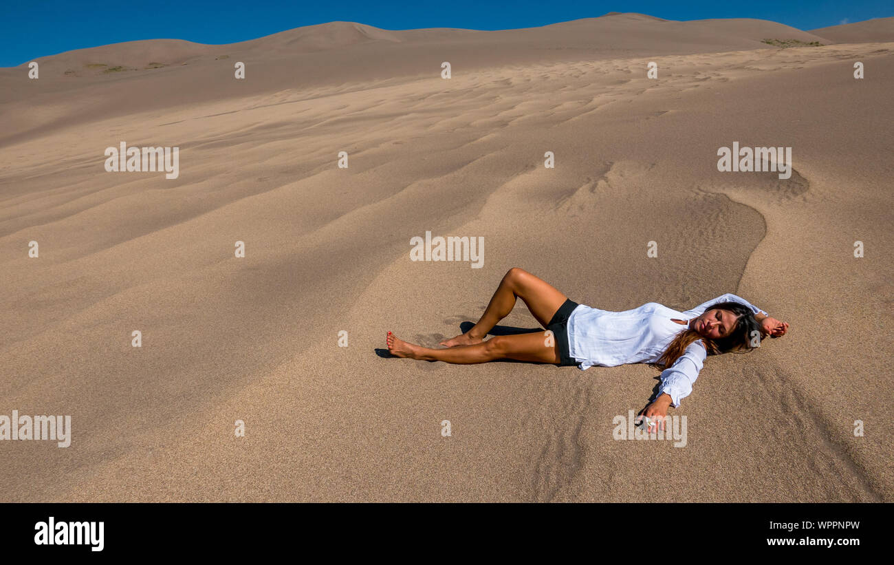 Woman lying in desert hi-res stock photography and images - Alamy