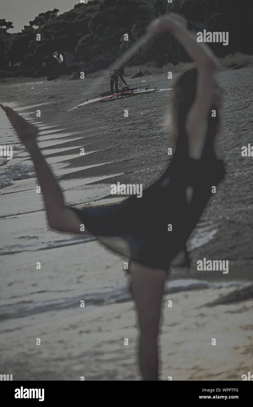 Woman dancing on the beach hi-res stock photography and images - Alamy