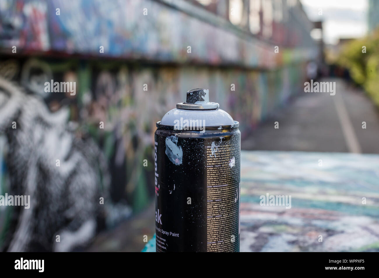 Spray-can and abstract graffiti paintings on the concrete wall. Background texture in London Stock Photo