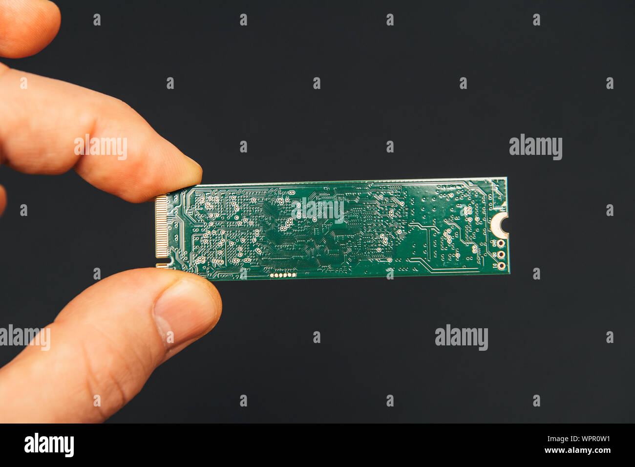 Man hand holding new fast NVM express Non-Volatile Memory Host Controller  Interface ssd hard disk drive Stock Photo - Alamy