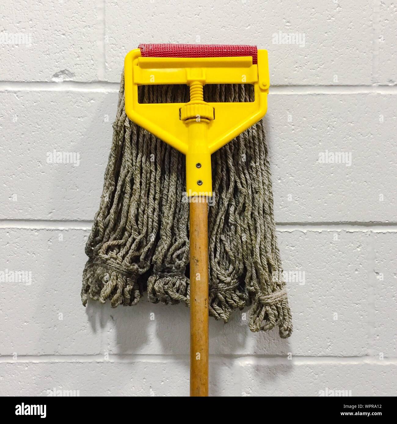 Mop Against Wall Stock Photo Alamy