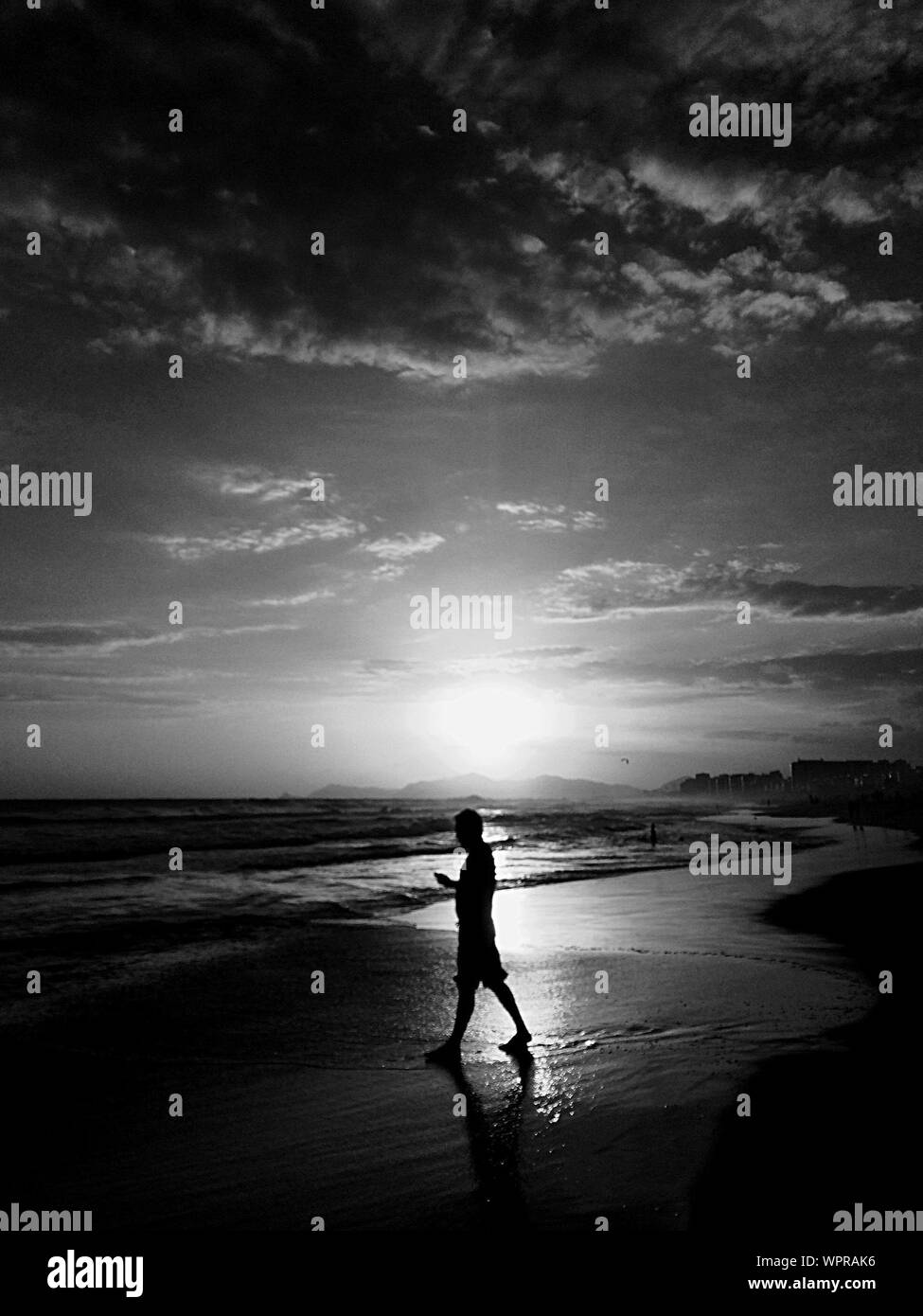 Man walking side view sunlight Black and White Stock Photos & Images ...