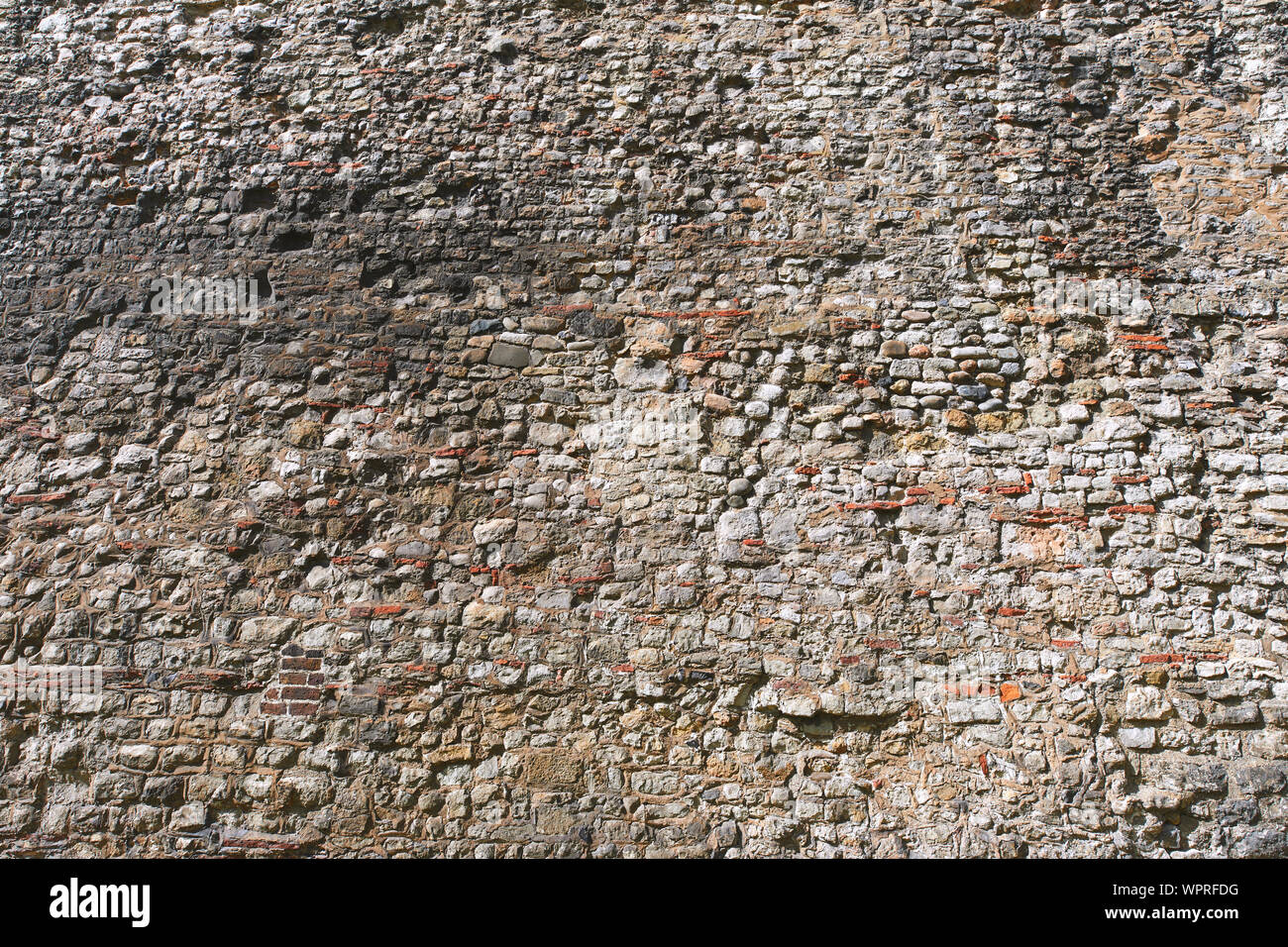 London, U.K. - Sept 1, 2019: A surviving section of the original defensive wall, first built by the Romans, around Londinium, at Tower Hill. Stock Photo