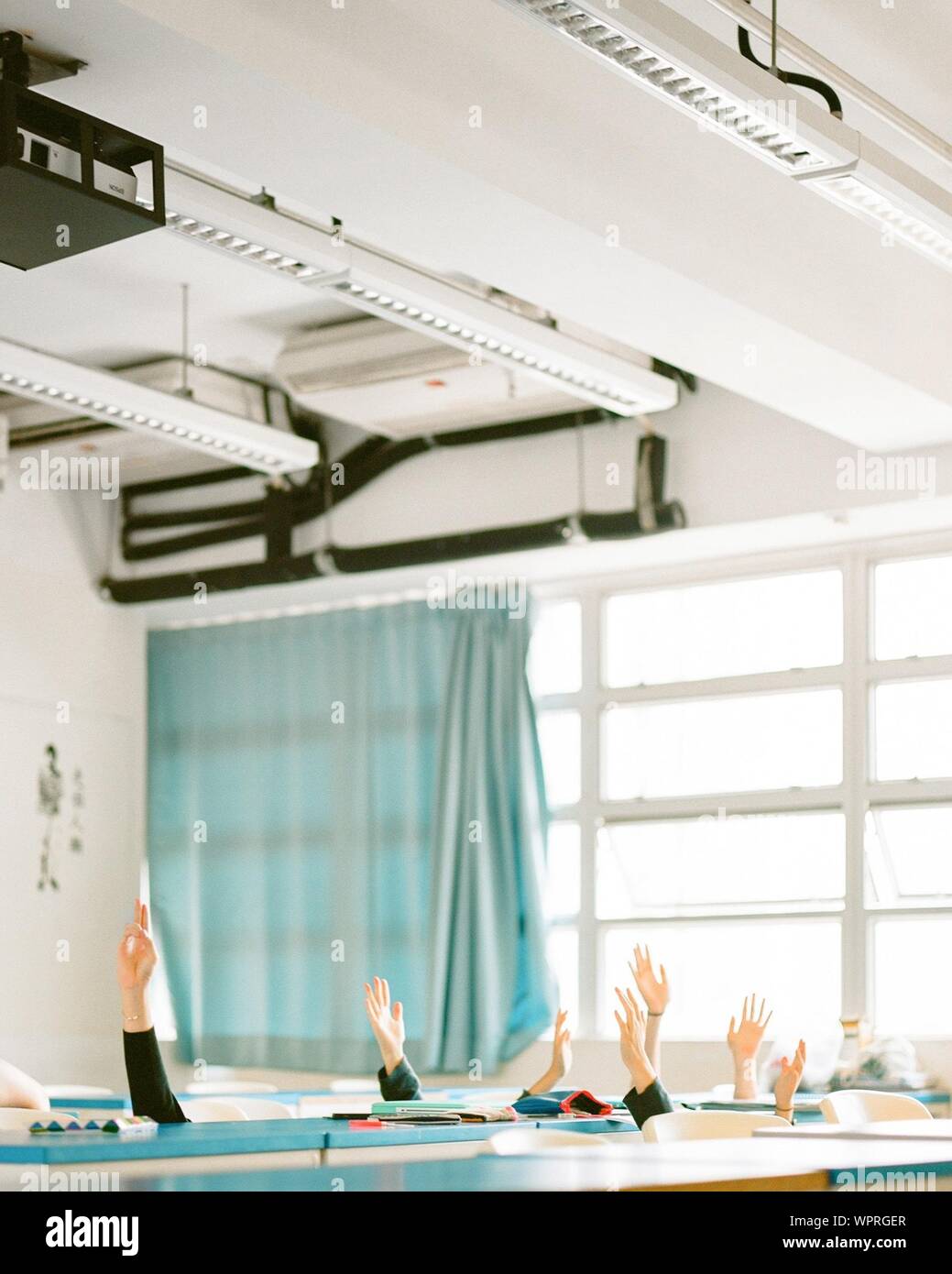 Raised hands classroom hi-res stock photography and images - Alamy