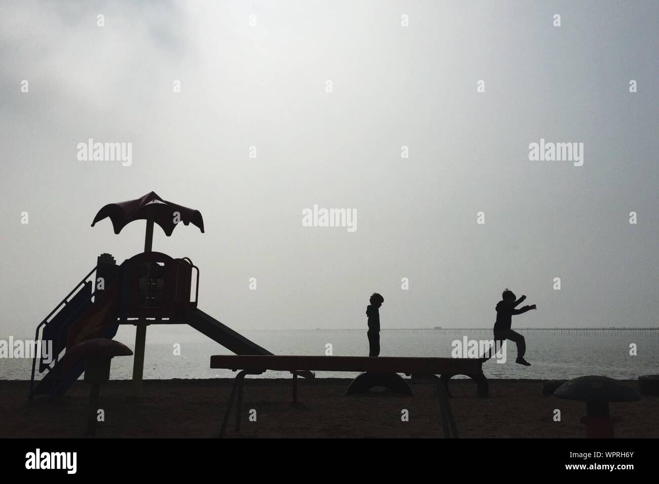 Two boys playing in the sea hi-res stock photography and images - Alamy