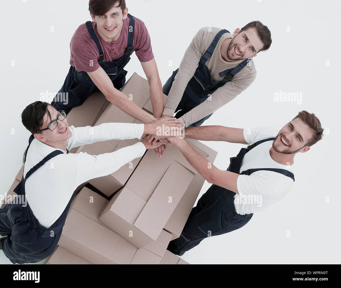 Young movers holding boxes. Delivering and transportation concept. Stock Photo