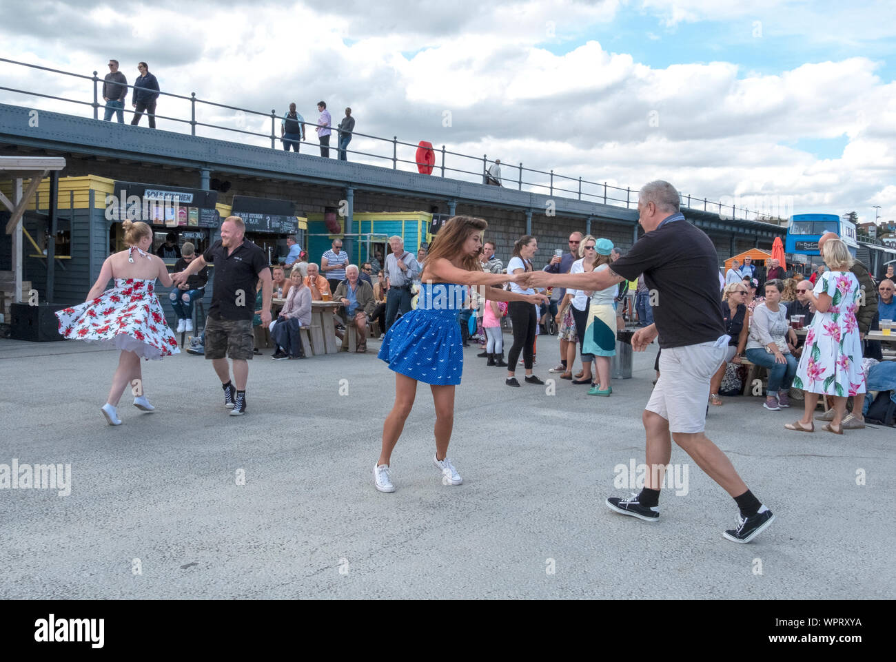 Swing dancing on a Sunday afternoon on the Harbour Arm at Folkestone, Kent, UK Stock Photo