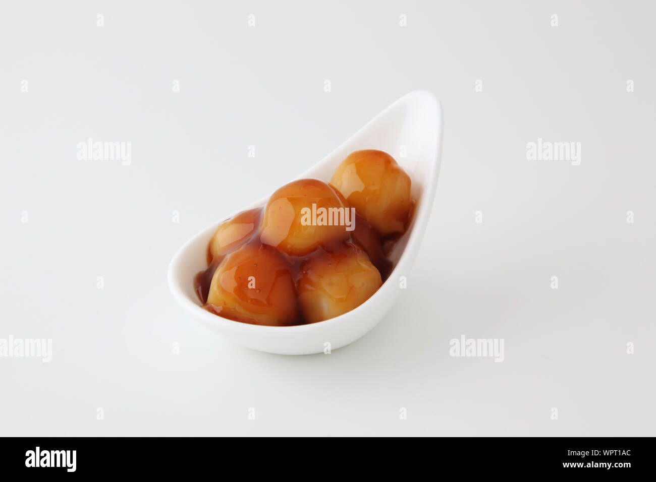dango dumpling Japanese sweet dessert with rice on plate isolated on white background mitarashi Stock Photo