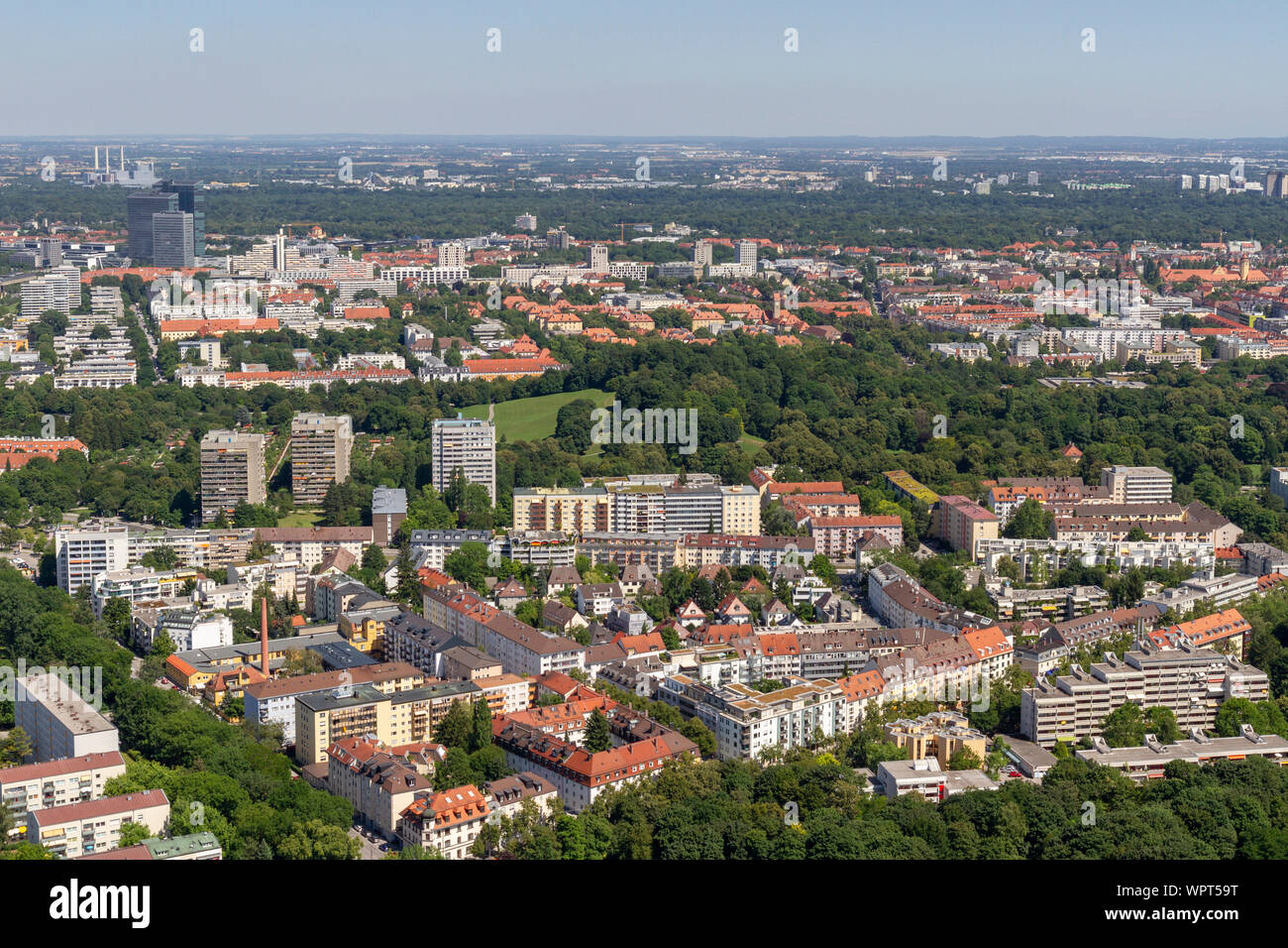 General view across of housing and parks east of the Olympiaturm (Olympic Tower), Munich, Bavaria, Germany. Stock Photo
