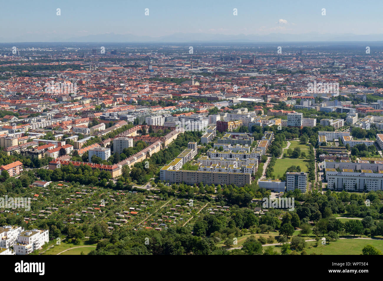 General view across allotment gardens and housing south east of the Olympiaturm (Olympic Tower), Munich, Bavaria, Germany. Stock Photo