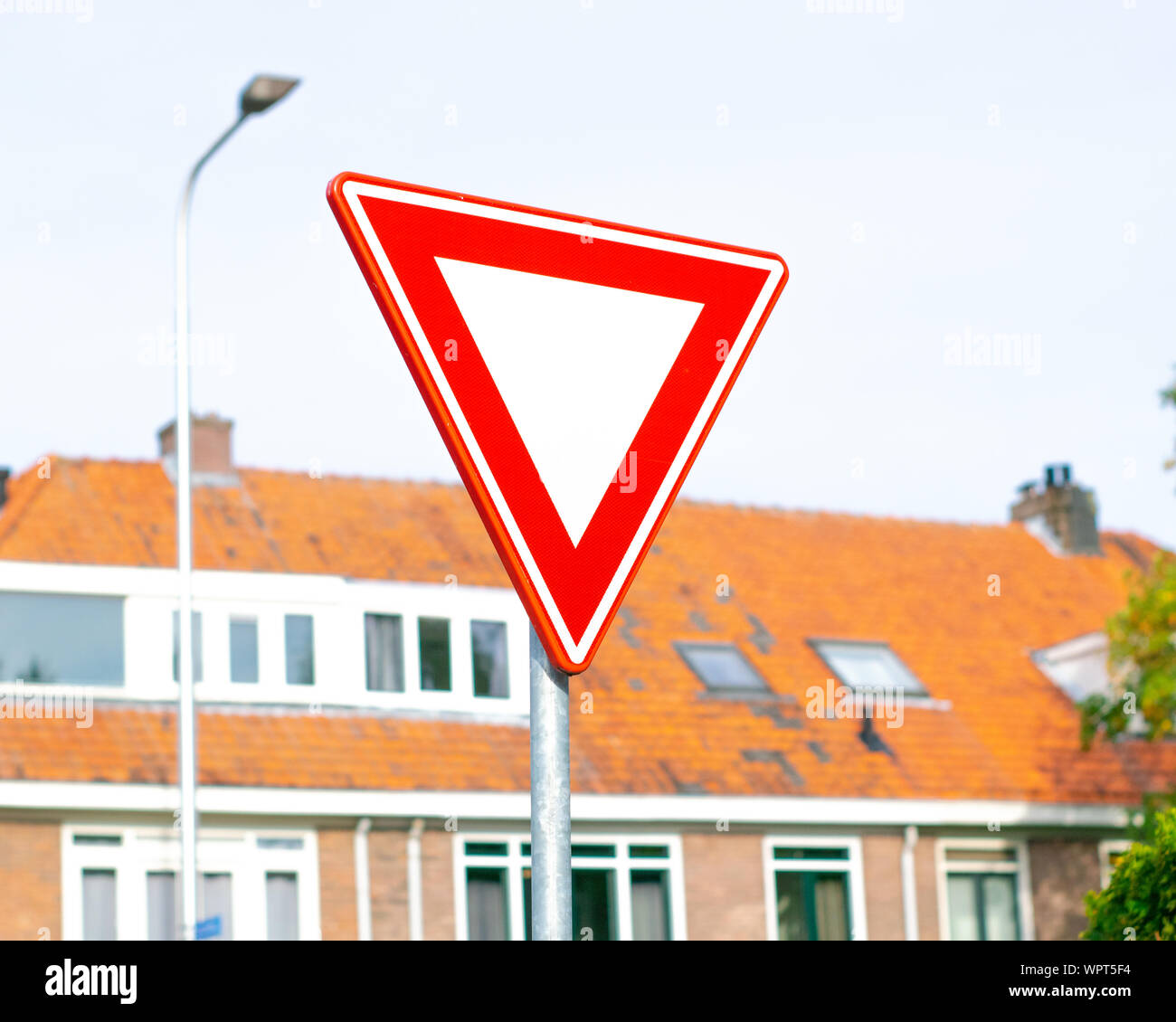 Dutch road sign: give priority to traffic on the main road ahead Stock Photo