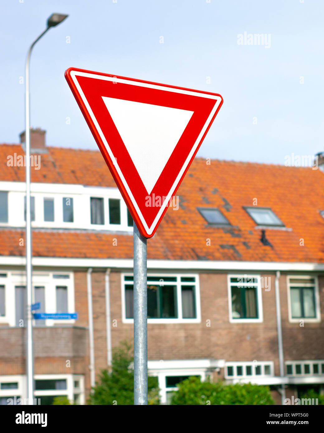 Dutch road sign: give priority to traffic on the main road ahead Stock Photo