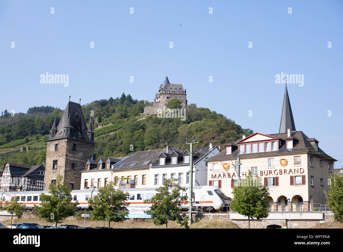 A train passes through the MiddleRhine town of Bacharach Stock Photo