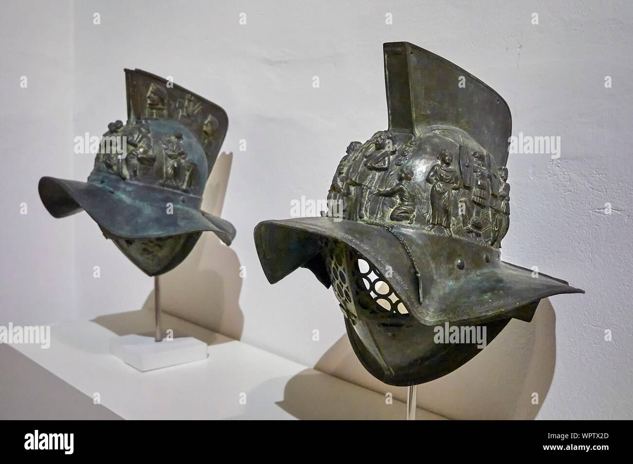 Gladiator helmets in cast bronze, embossed and chiselled from the 1st  century A.D. Pompeii, National Archaeological Museum of Naples, Amodio,  1885 Stock Photo - Alamy