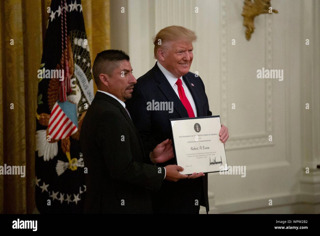 Washington, United States Of America. 09th Sep, 2019. United States President Donald J. Trump presents Heroic Commendations to Robert Evans during an East Room ceremony at the White House in Washington, DC, U.S. on September 9, 2019. Credit: Stefani Reynolds/CNP | usage worldwide Credit: dpa/Alamy Live News Stock Photo