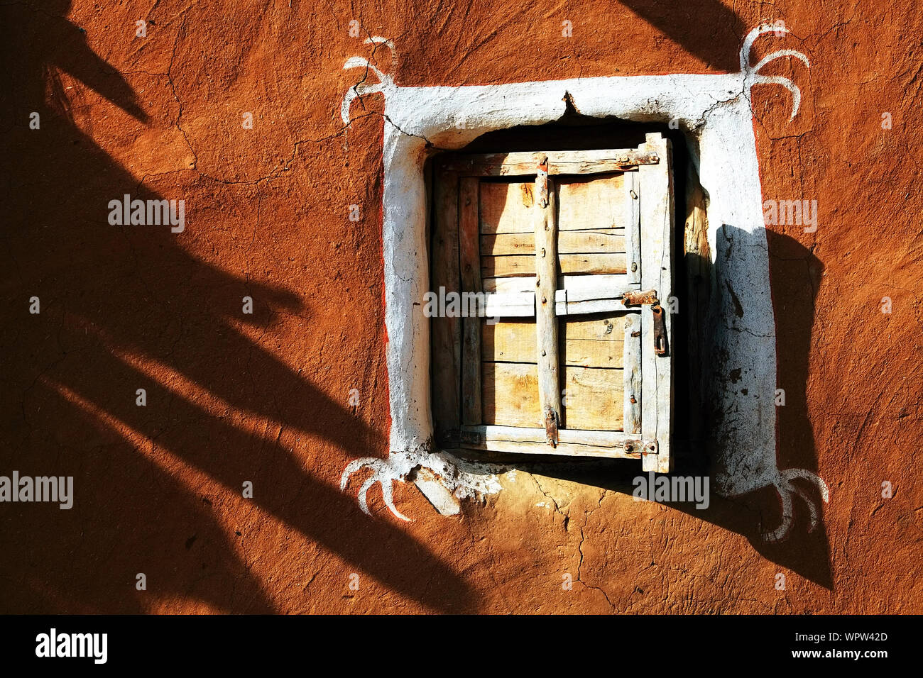 Closed Wooden Window Of Old Mud Hut Stock Photo