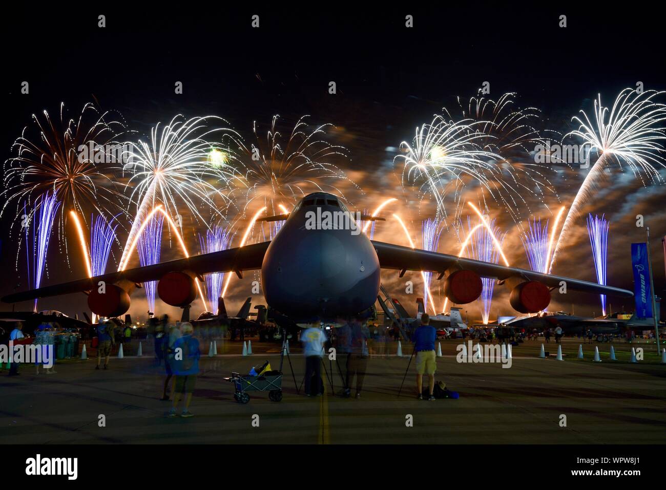 Spectacular fireworks explode behind massive Lockheed C5M Super Galaxy