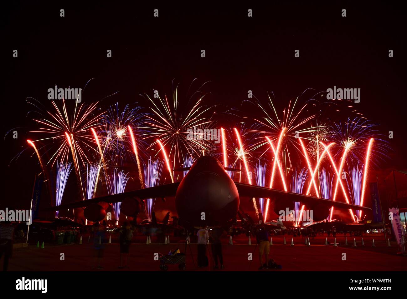 Spectacular fireworks explode behind massive Lockheed C-5M Super Galaxy ...