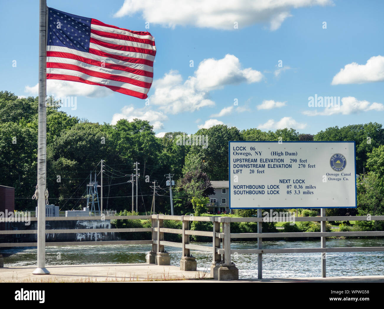 Oswego, New York, USA. September 6, 2019. Lock 6 of the historic Erie Canal in Oswego, New York with American flag on a beautiful late summer day Stock Photo