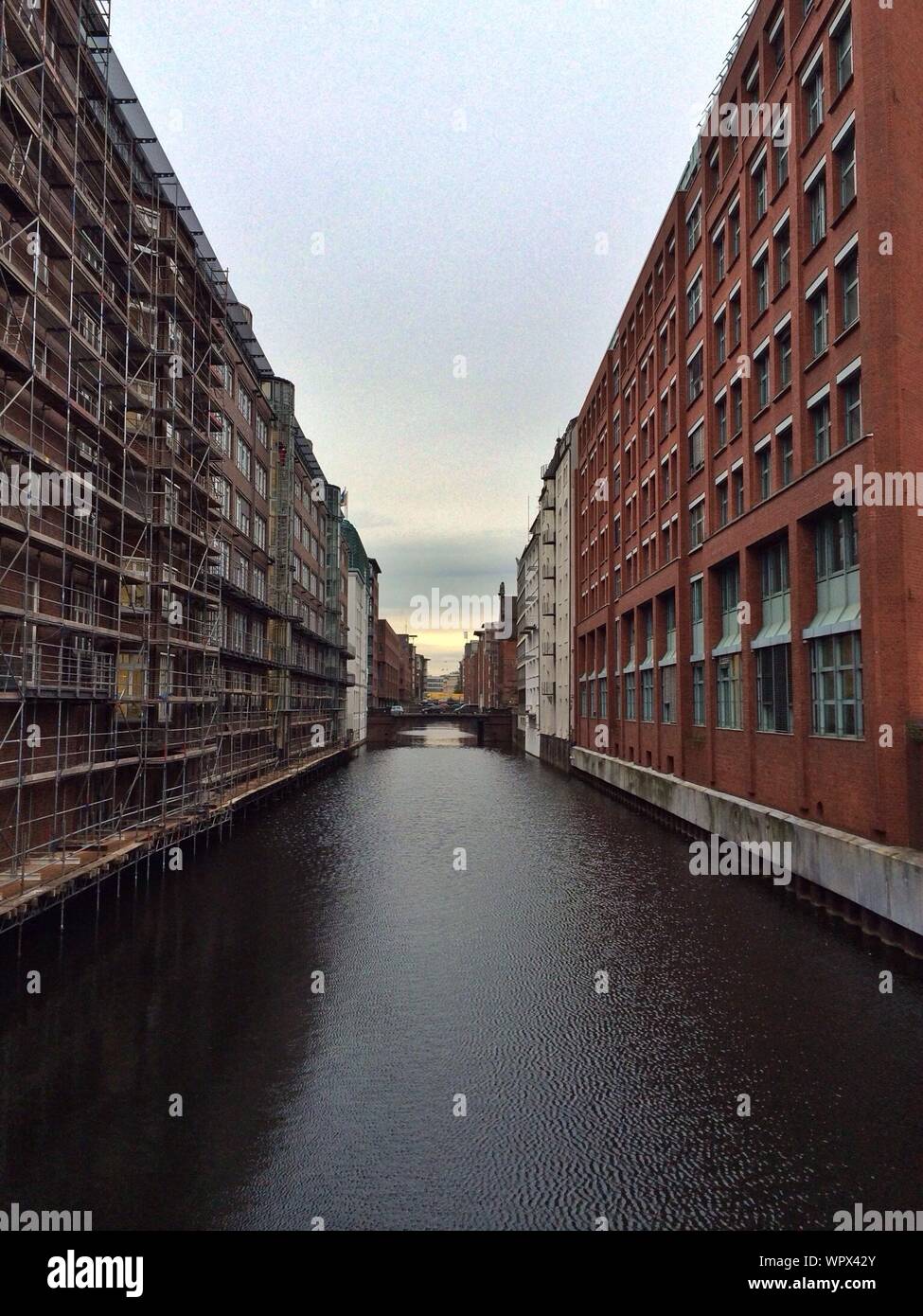 View Of Canal Along Buildings Stock Photo