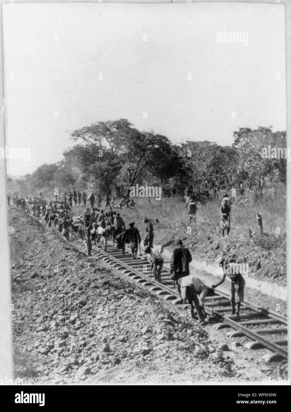 Man building railway planned by Cecil Rhodes near Broken Hill, Rhodesia Stock Photo