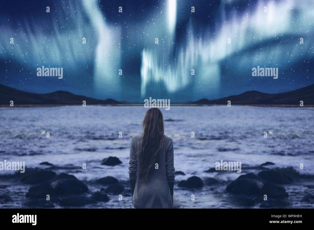 Woman looking up sky night hi-res stock photography and images - Alamy