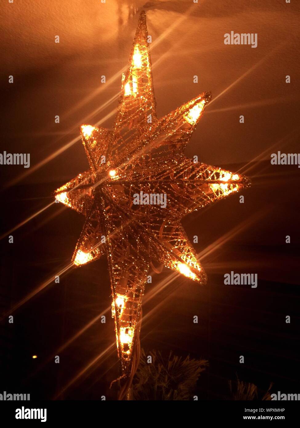 Close Up Of Illuminated Christmas Decoration Hanging From
