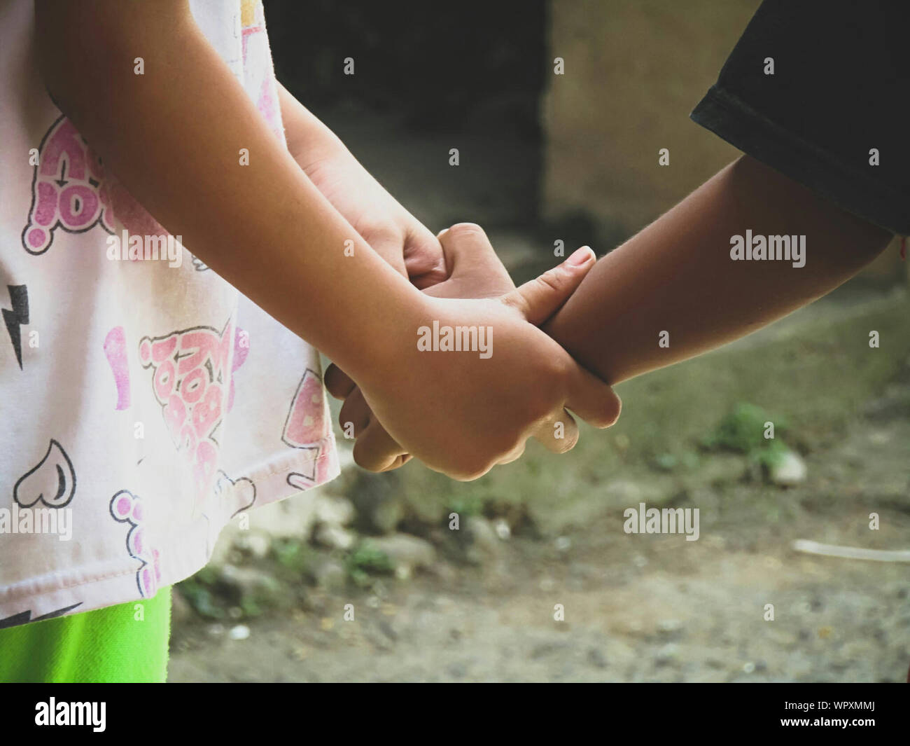 Children holding hands up hi-res stock photography and images - Alamy