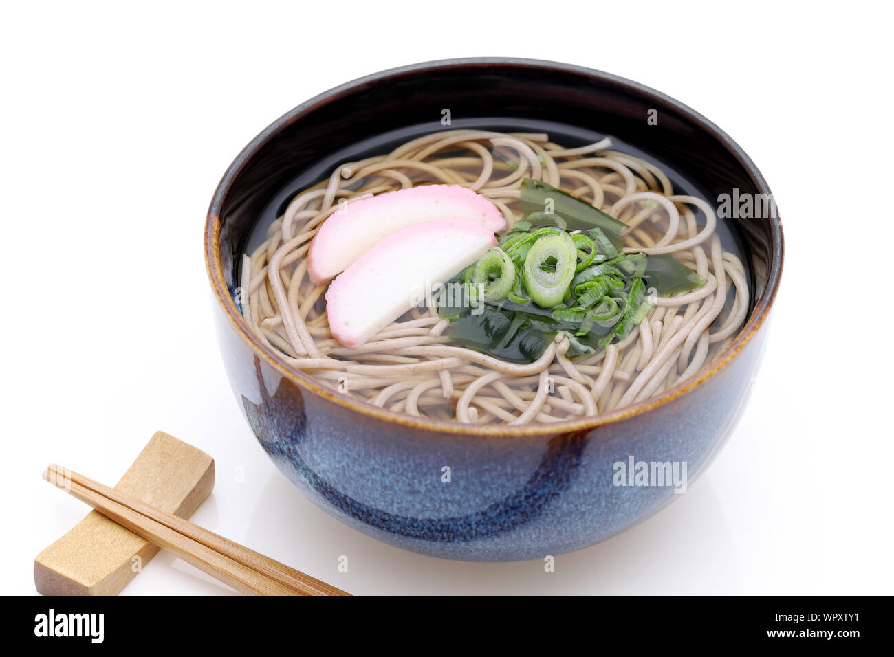 Japanese Kake soba noodles in a ceramic bowl Stock Photo