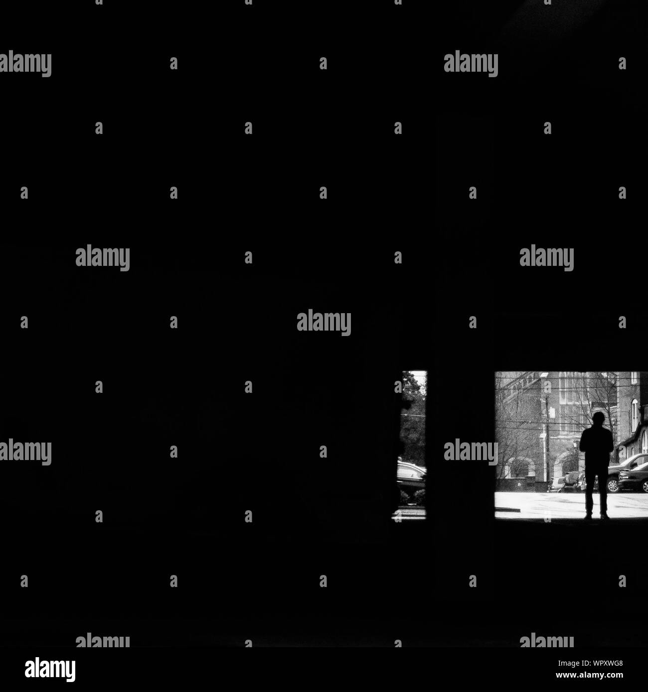 Rear view silhouette man standing Black and White Stock Photos & Images ...