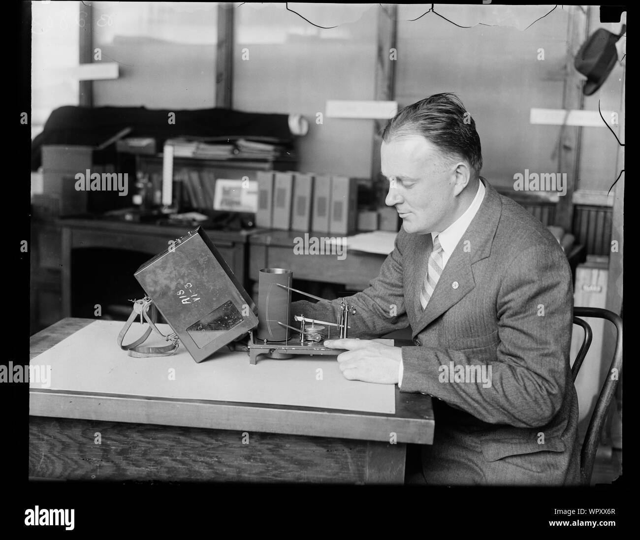 Man with device aircraft barograph Stock Photo