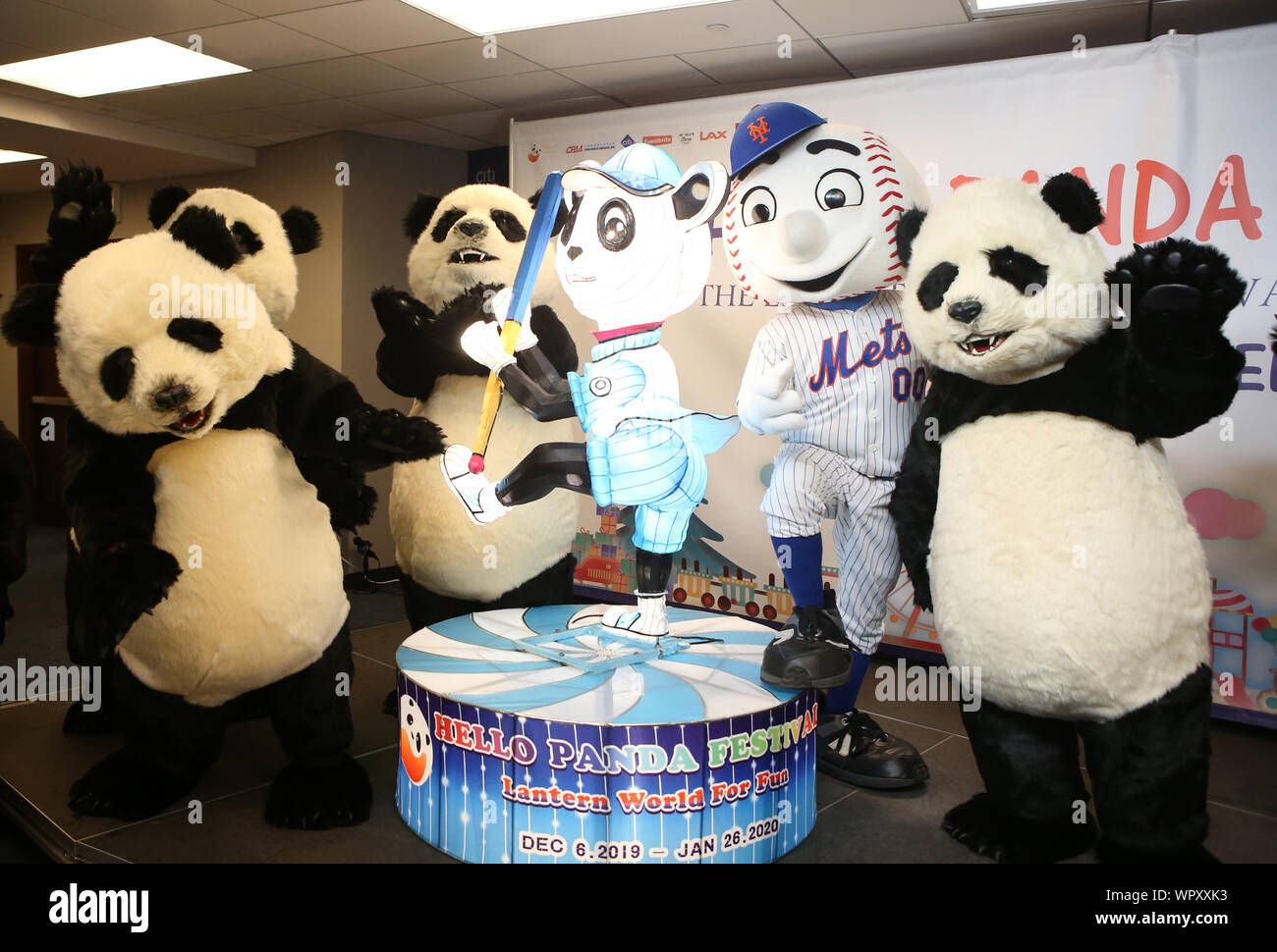 The Washington Nationals' presidential mascots and official mascot,  Screech, pose for a photo with Army Secretary