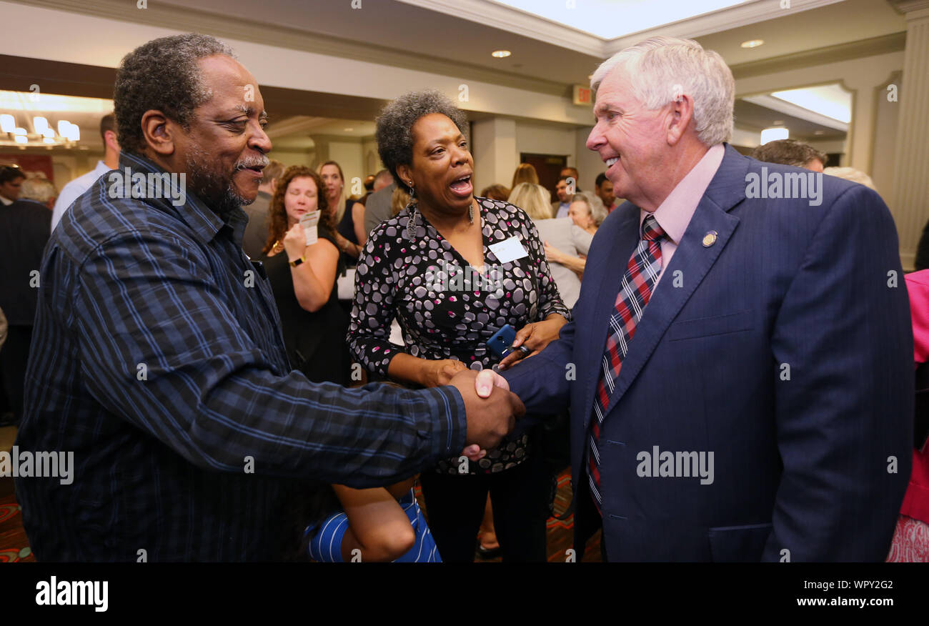 Creve Coeur, Missouri, USA. 9th Sep 2019. Missouri Governor Mike Parson stops to say hello to Zina and Brian Hackworth following announcing he will be seeking another term as Governor, announcing in Creve Coeur, Missouri on Monday, September 9, 2019. Parson formally announced in his hometown of Bolivar, Missouri on September 8, 2019 and has spent the day announcing in several locations around the state. Photo by Bill Greenblatt/UPI. Credit: UPI/Alamy Live News Stock Photo