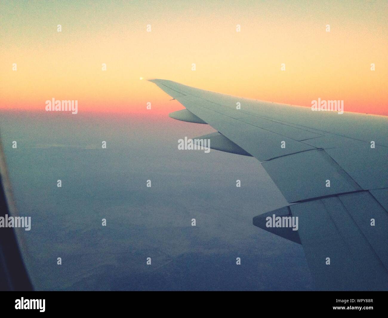 Airplane Wing In Sunset Flight High Resolution Stock Photography and ...