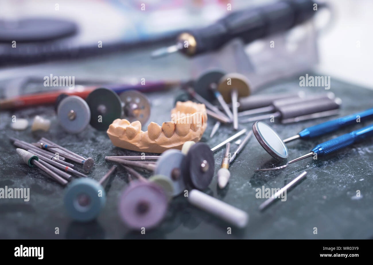 Artificial tooth being done by a dental prosthesis specialist. Stock Photo