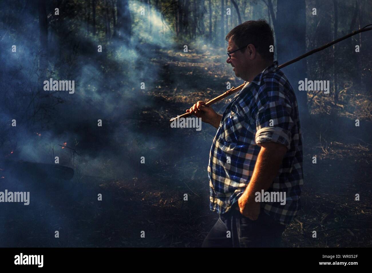 Walking man with stick hi-res stock photography and images - Alamy
