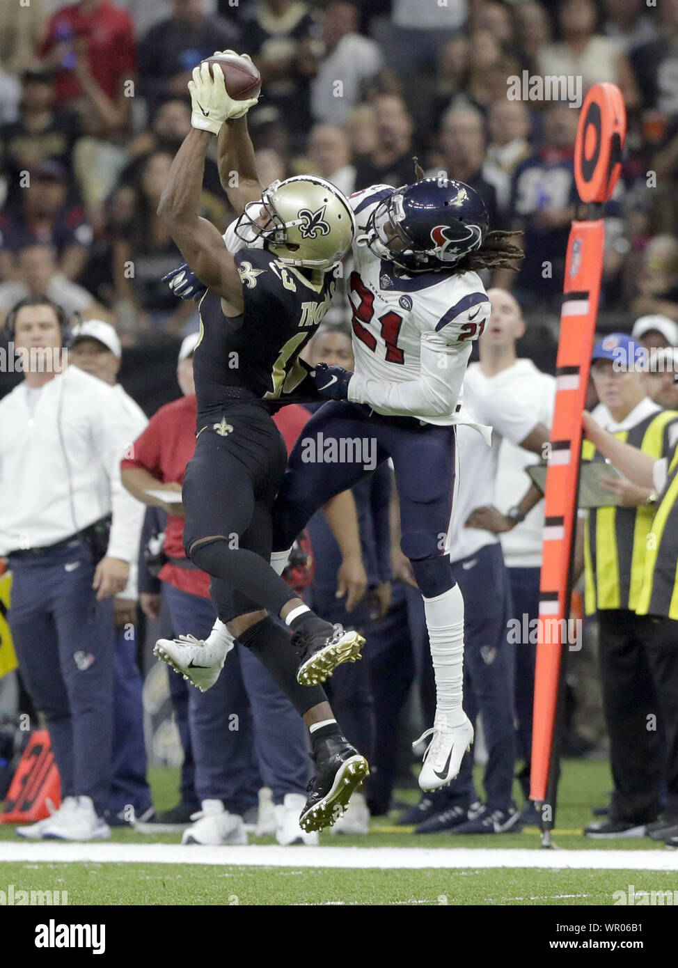 New Orleans, United States. 09th Sep, 2019. New Orleans Saints wide receiver Michael Thomas (13) catches a Drew Brees pass in front of Houston Texans cornerback Bradley Roby (21) for a first down late in the second quarter at the Louisiana Supedome in New Orleans on Monday, September 9, 2019. Photo by AJ Sisco/UPI Credit: UPI/Alamy Live News Stock Photo