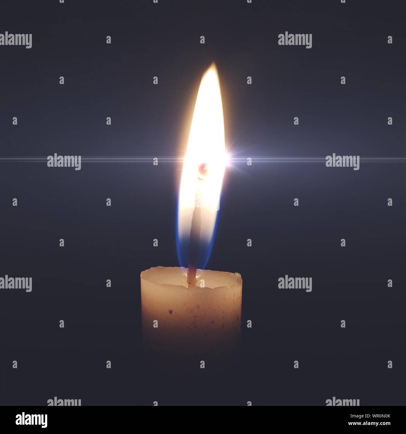 Lit candle in the dark room hires stock photography and images Alamy