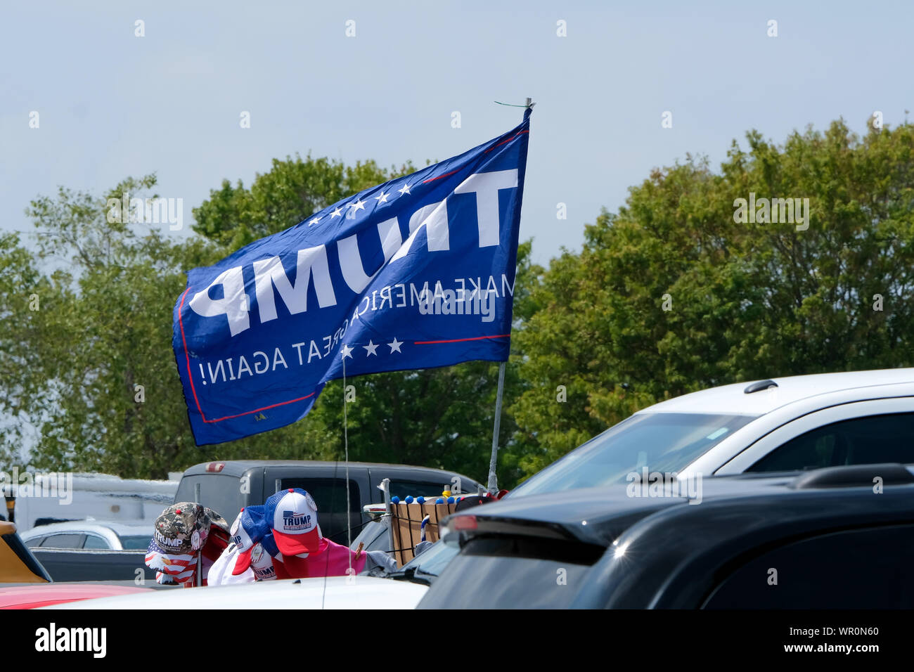 Fayetteville, United States. 09th Sep, 2019. A banner waving while supporters await President Trump during the MAGA rally in Fayetteville. Credit: SOPA Images Limited/Alamy Live News Stock Photo