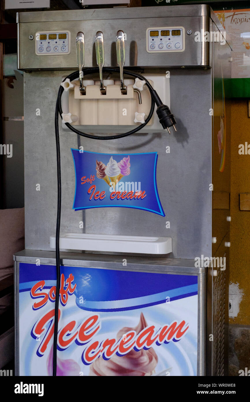ice cream machine outside a bar restaurant unplugged from the mains electricity supply at the end of the summer season lenti zala county hungary Stock Photo