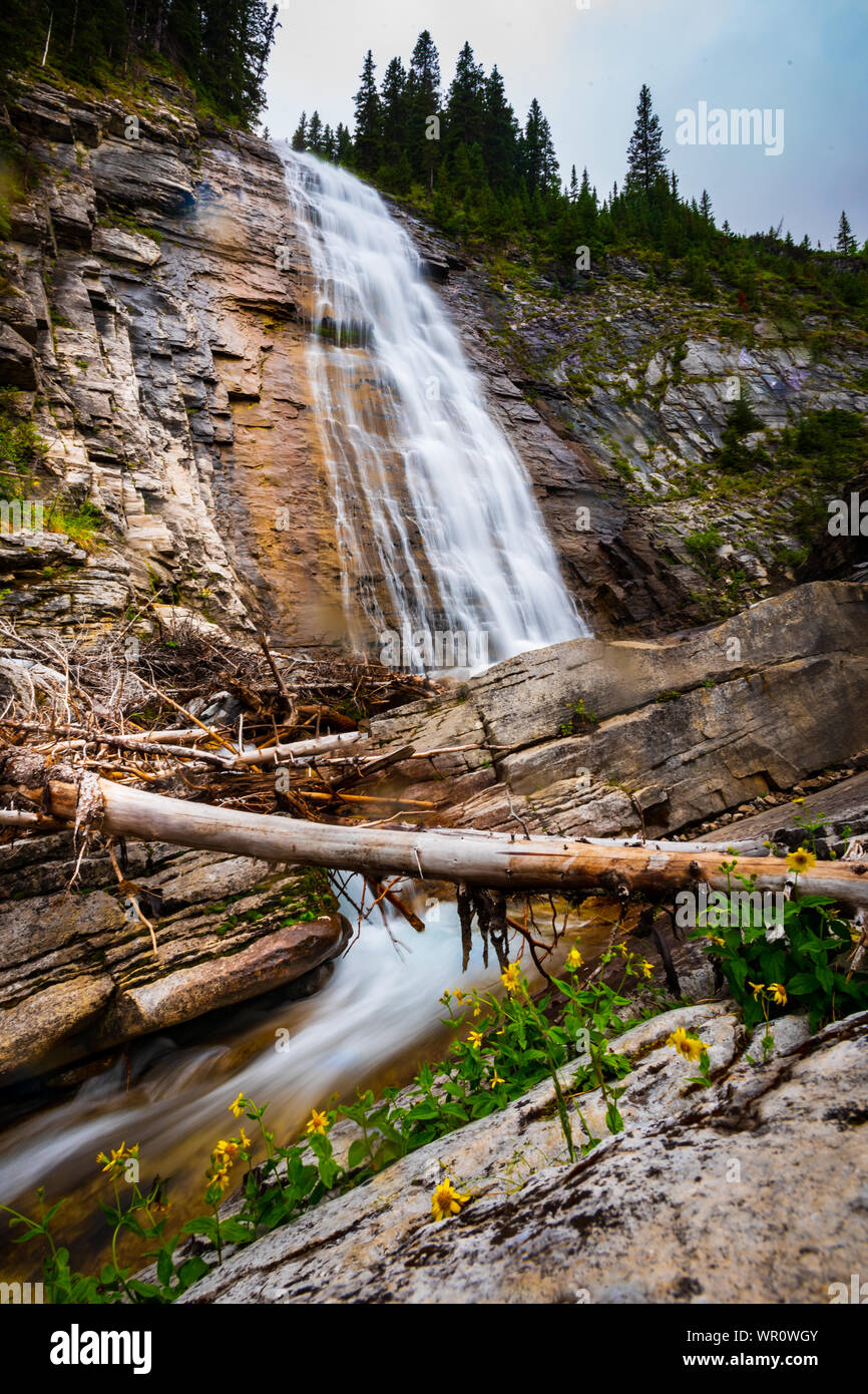 Scenic waterfall and mountain creek running through the forest. Ribbon Falls hiking Trail