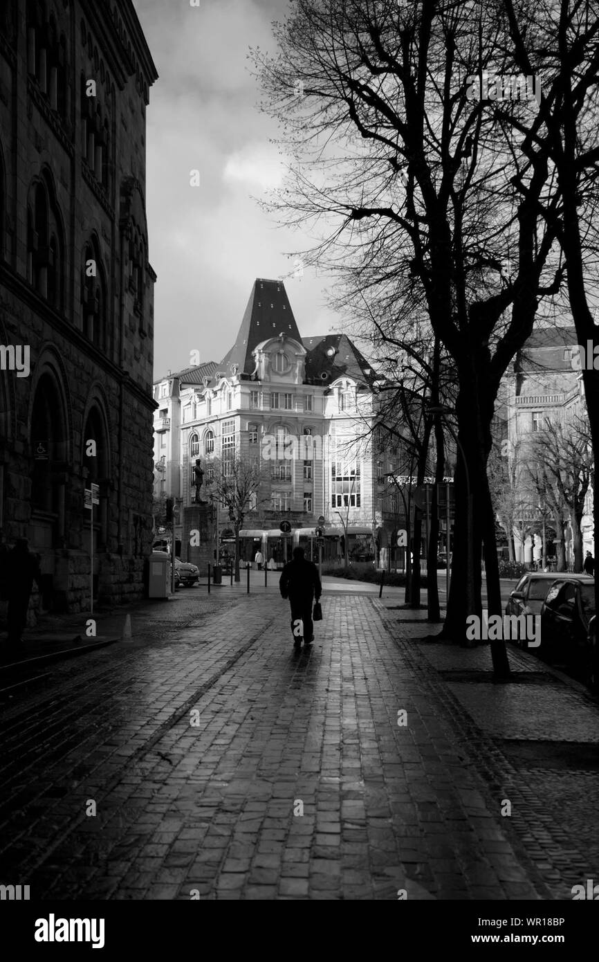 Rear Man Rear man walking sidewalk architecture hi-res stock photography and ...