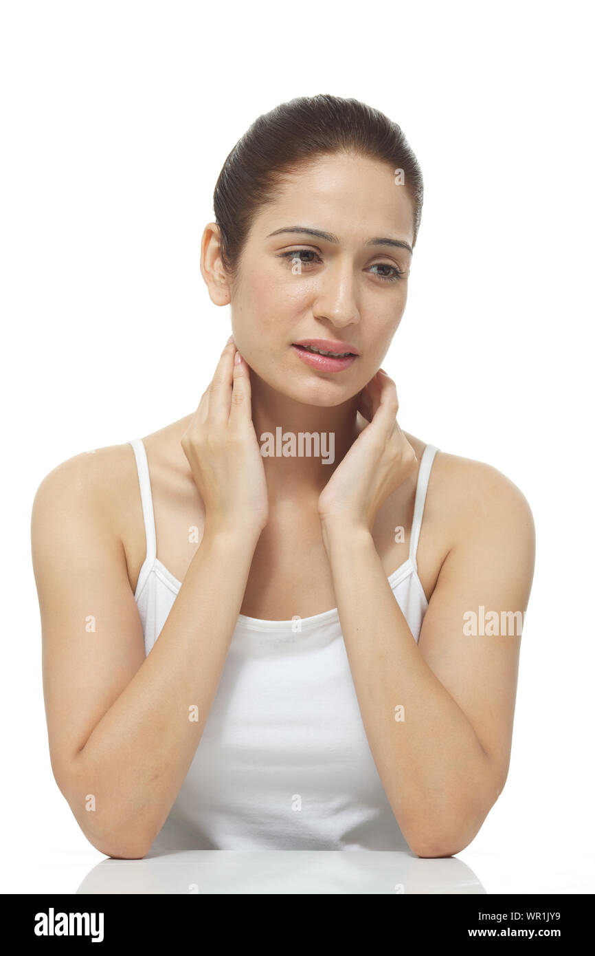 Young woman suffering from neck pain Stock Photo Alamy