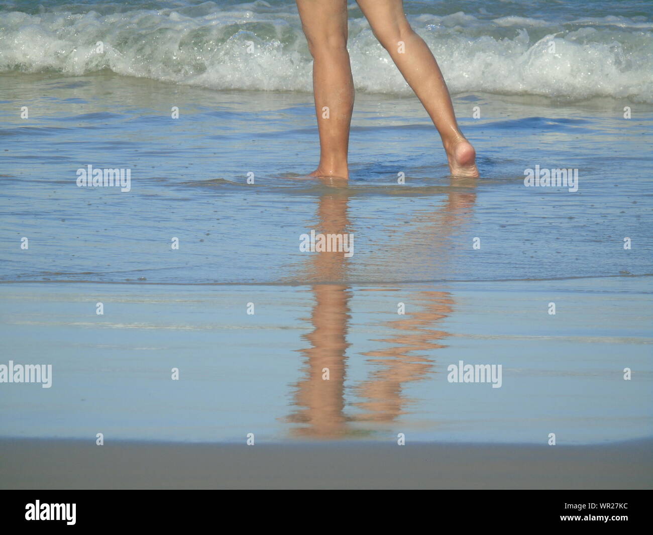 Reflection woman walking shallow water hi-res stock photography and ...