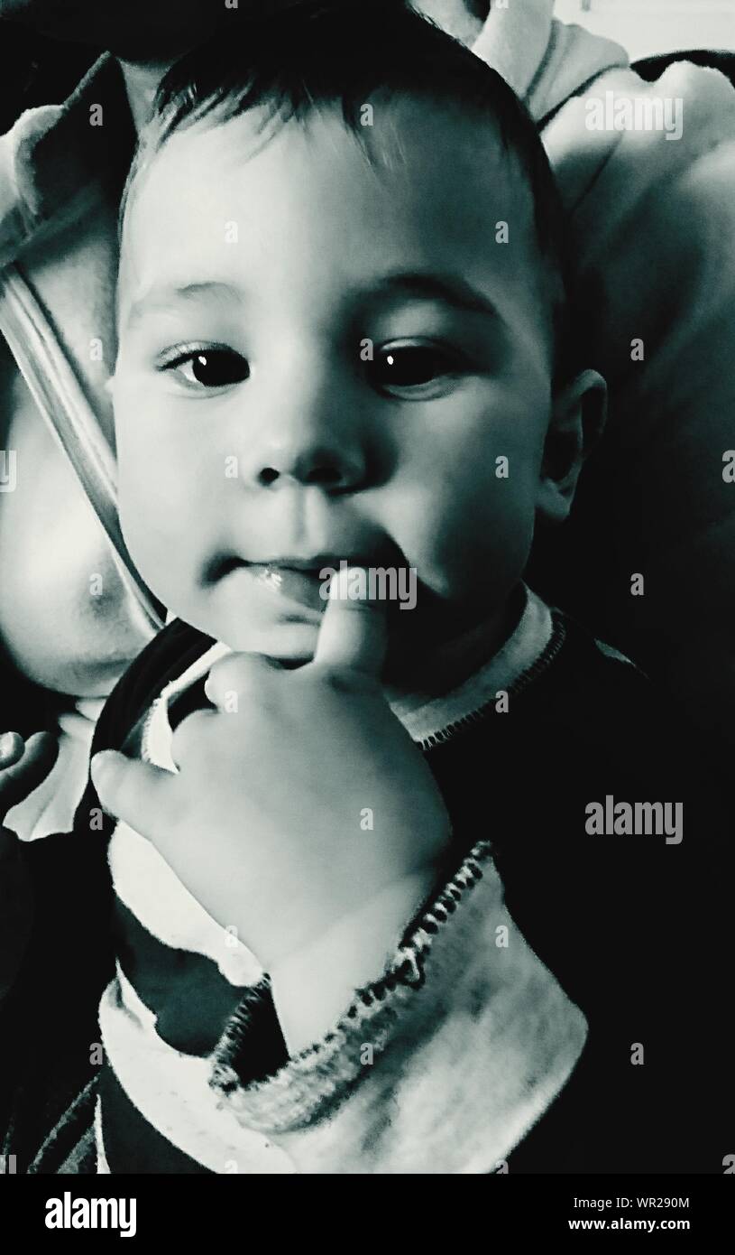 Finger in mouth boy hires stock photography and images Alamy