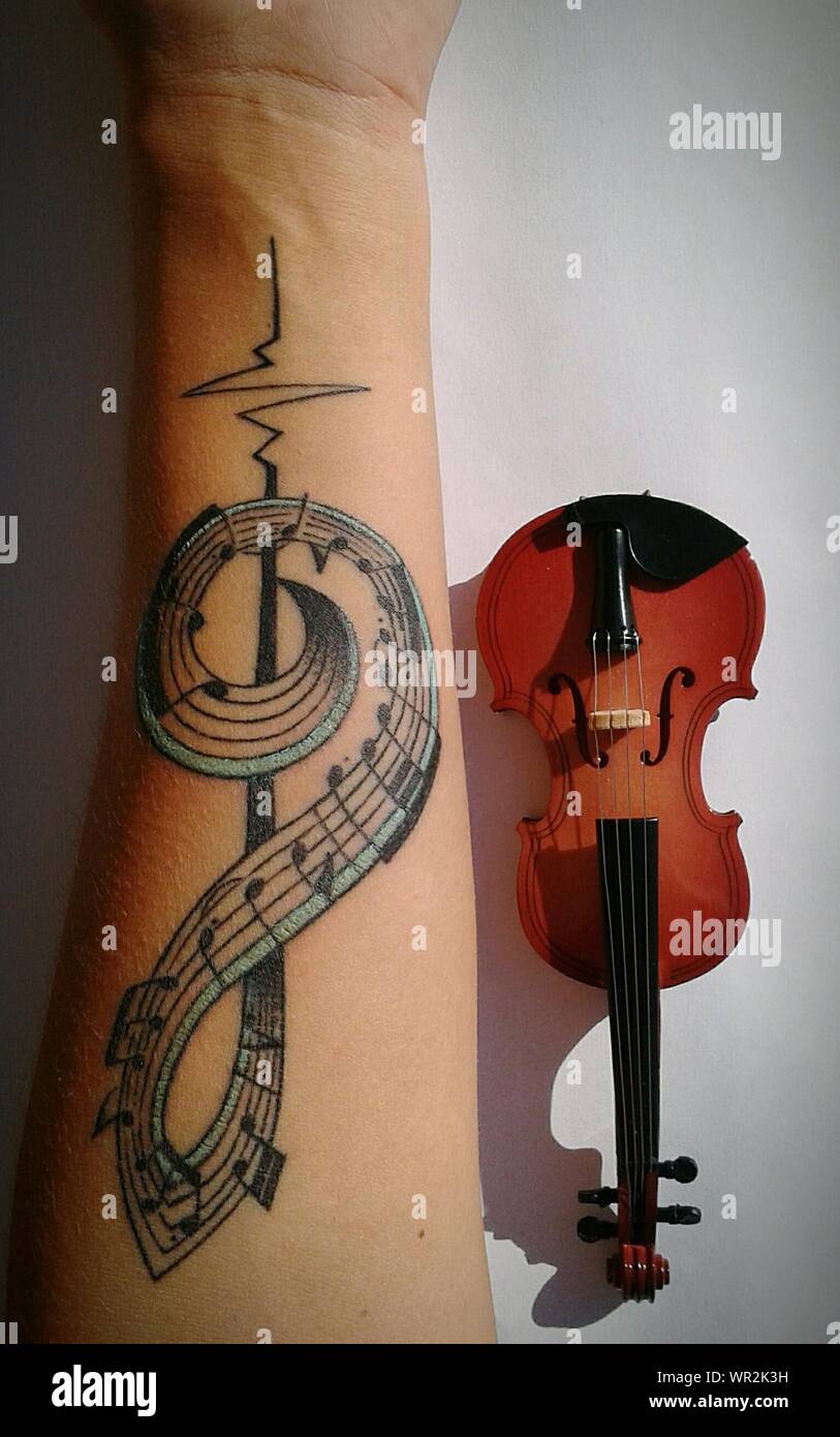 Musical note tattoo hi-res stock photography and images - Alamy
