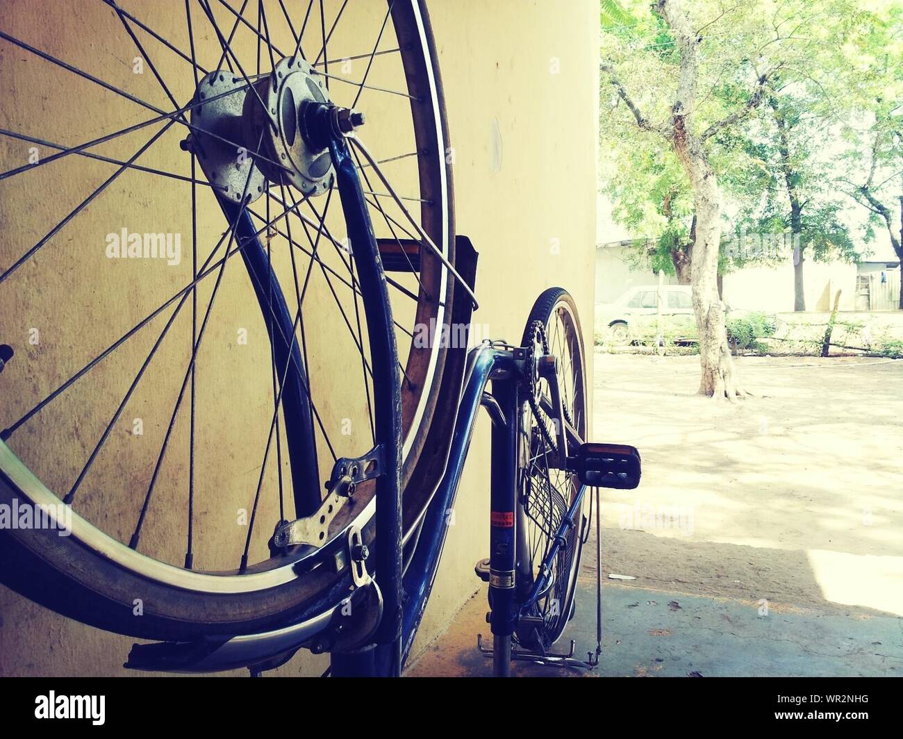 Upside Down Bicycle Against Wall Stock Photo Alamy