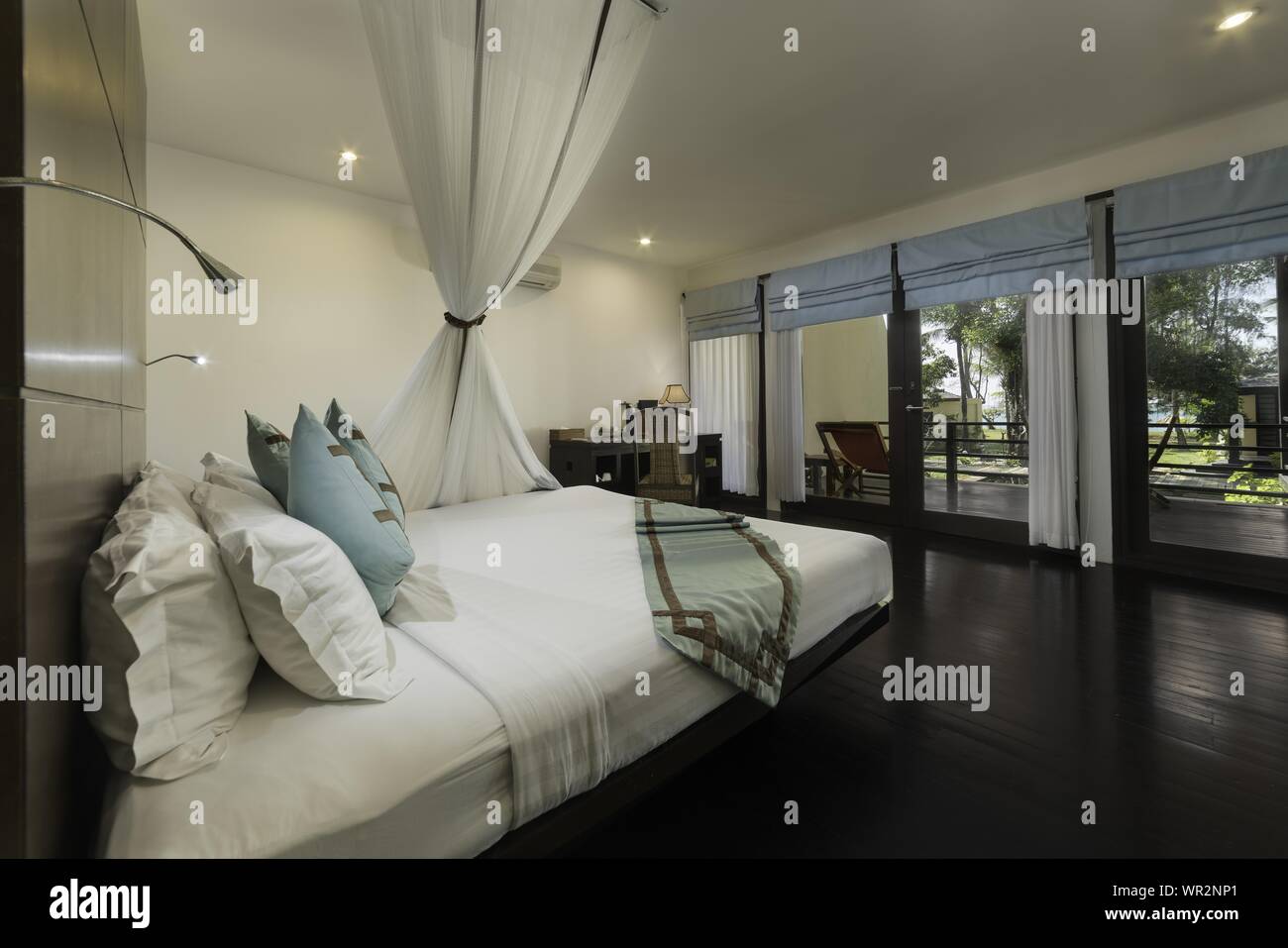 An Interior Shot Of A Beautiful Room With Window Balcony
